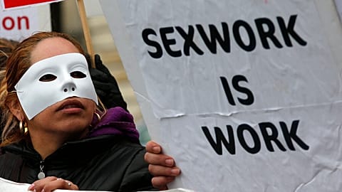 A French sex worker demonstrates outside the National Assembly in Paris, Friday, Nov. 29, 2013. 