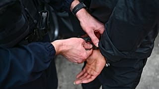 A young person is released after control by a policemen at the "Paternelle" neighborhood in the northern district of Marseille on March 31.
