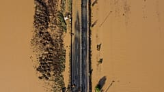 This aeriel view, taken on Friday, shows a partially destroyed road in a flooded area near the village of Itea, central Greece