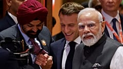 Emmanuel Macron joins Narendra Modi and World Bank President Ajay Banga at the second session of the G20 Leaders' Summit in New Delhi on September 9