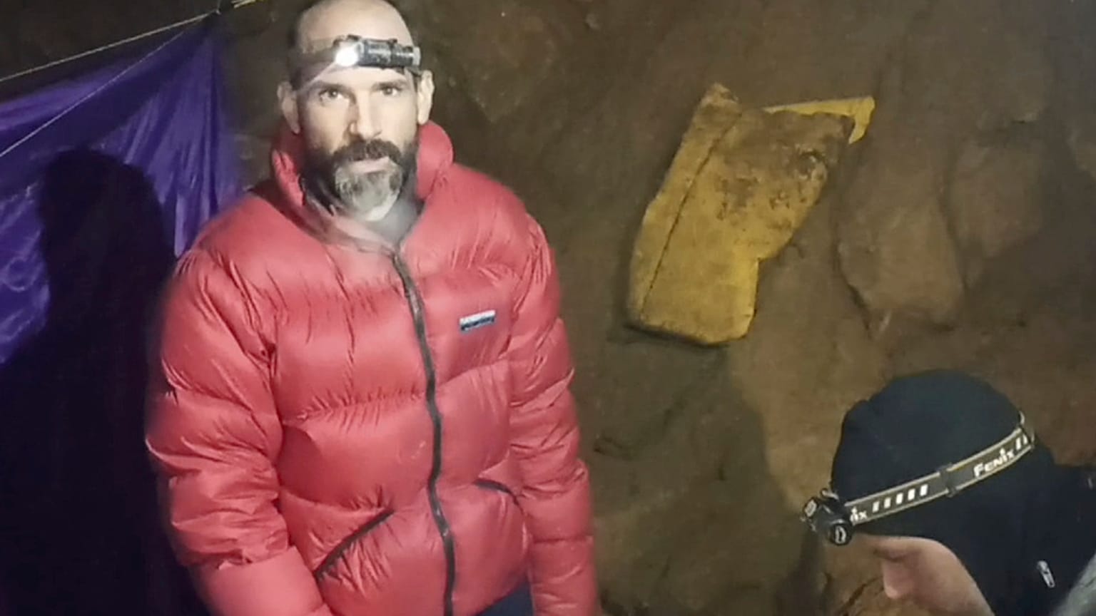 In this screen grab from video, American caver Mark Dickey, 40, talks to camera next to a colleague inside the Morca cave near Anamur, southern Turkey, Thursday, Sept. 7, 2023
