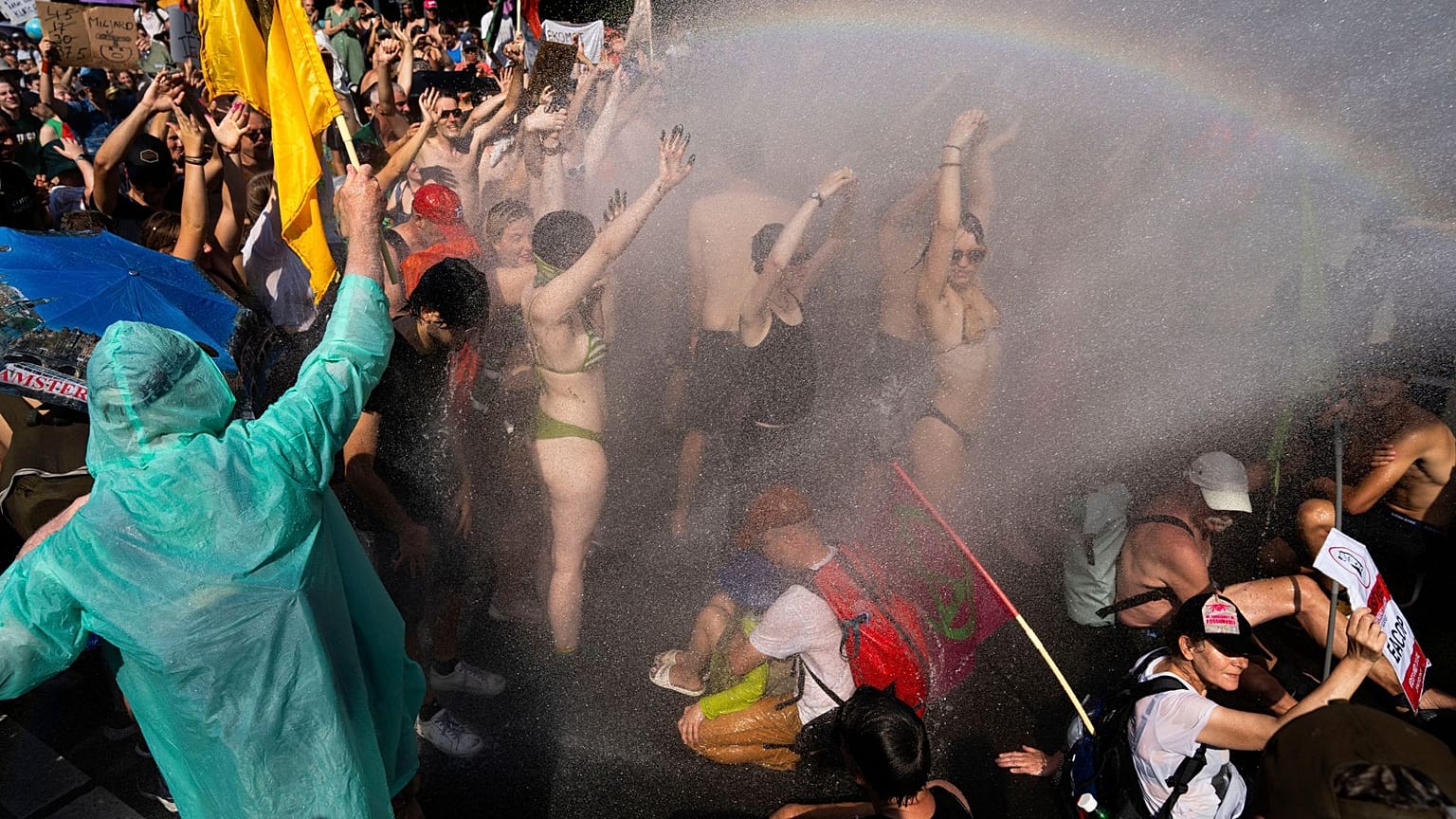 Dutch police uses a water cannon to disperse protestors who blocked a highway during a climate protest on Saturday 9 September 2023. 