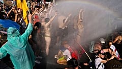 Dutch police uses a water cannon to disperse protestors who blocked a highway during a climate protest on Saturday 9 September 2023. 