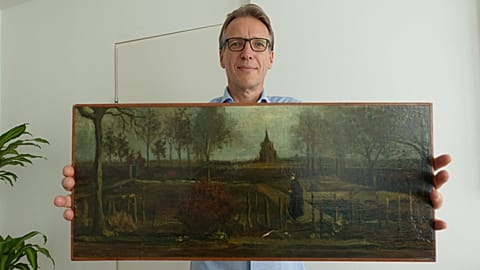 Arthur Brand with "Parsonage Garden at Nuenen in Spring" painting.