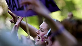 Demonstrators hold placards and shout slogans during a protest in Madrid AGAINST "La Manada"