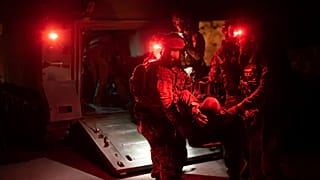 Ukrainian paramedics carry wounded near Bakhmut, Donetsk region, Ukraine, Tuesday Sept. 12, 2023.