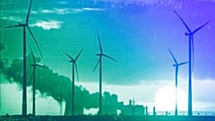 Steam rises from the coal-fired power plant near wind turbines in Niederaussem, November 2022