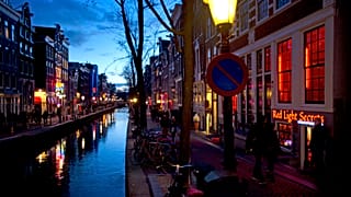 The entrance of the 'Red Light Secrets' prostitution museum is seen, right, in Amsterdam.