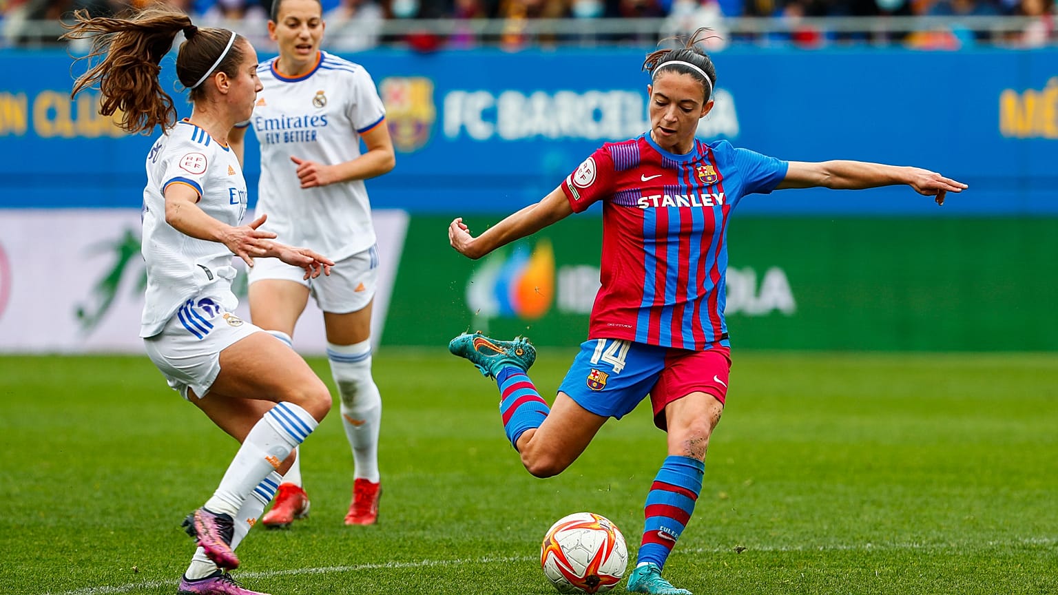 Barcelona's Aitana Bonamati, right, shoots the ball next to Real Madrid's Maite Oroz during the Women's Spanish La Liga soccer match between FC Barcelona and Real Madrid in Ba