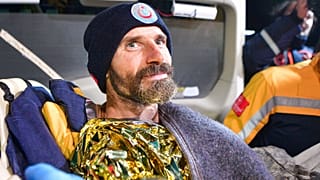 American researcher Mark Dickey is carried in a stretcher after being pulled out of Morca cave near Anamur, south Turkey, on September 12