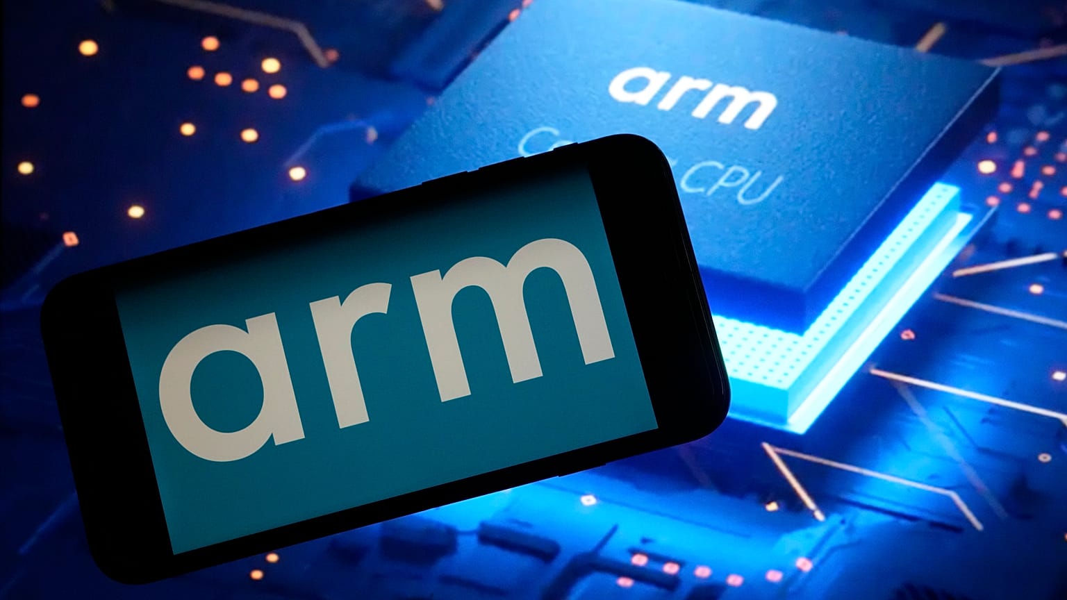 The logo for chip designer Arm and an Arm webpage are shown in this photo, in New York, Wednesday, Sept. 6, 2023