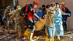 In this photo provided by Turkey's IHH humanitarian aid group, rescuers retrieve the body of a flooding victim in Derna, Libya, Wednesday, Sept.13, 2023. 