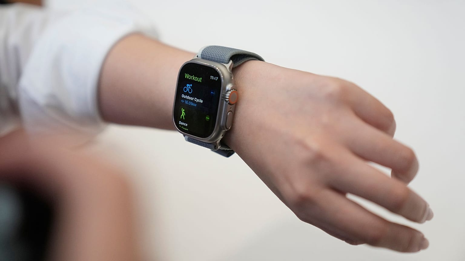 A person tries on an Apple Watch during an announcement of new products on the Apple campus, 12 September 2023, in Cupertino, California.