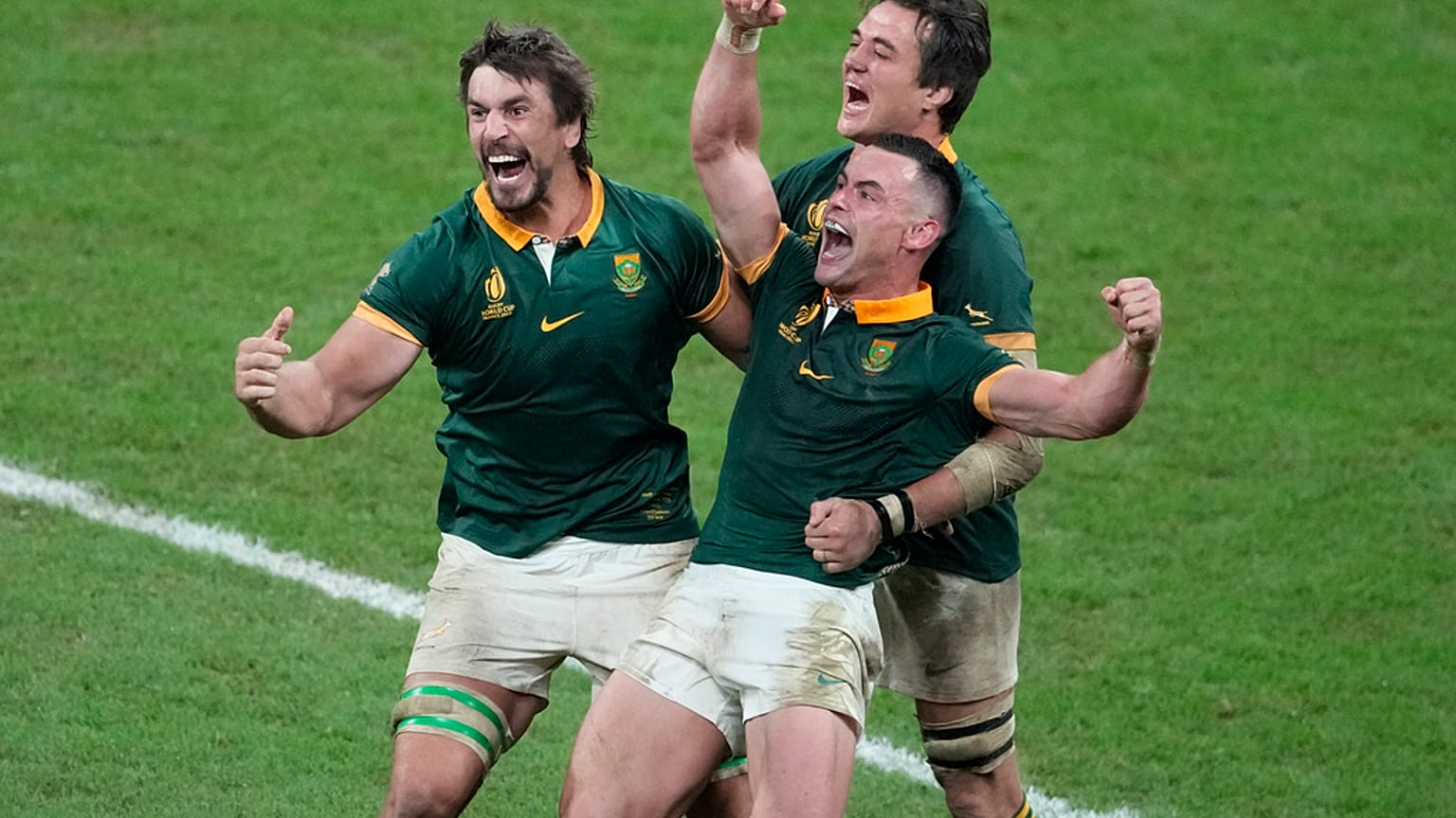 South Africa players celebrate at the end of the Rugby World Cup final match between New Zealand and South Africa at the Stade de France in Saint-Denis, near Paris Saturday, O