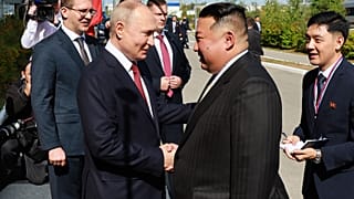Russian President Vladimir Putin and North Korea's leader Kim Jong Un shake hands during their meeting at the Vostochny cosmodrome outside Tsiolkovsky on 13 September