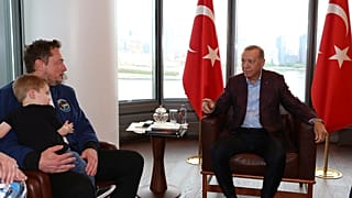 Turkish president Recep Tayyip Erdogan, right, talks to Elon Musk, holding one of his sons, during their meeting in New York, Sunday, September 17, 2023.