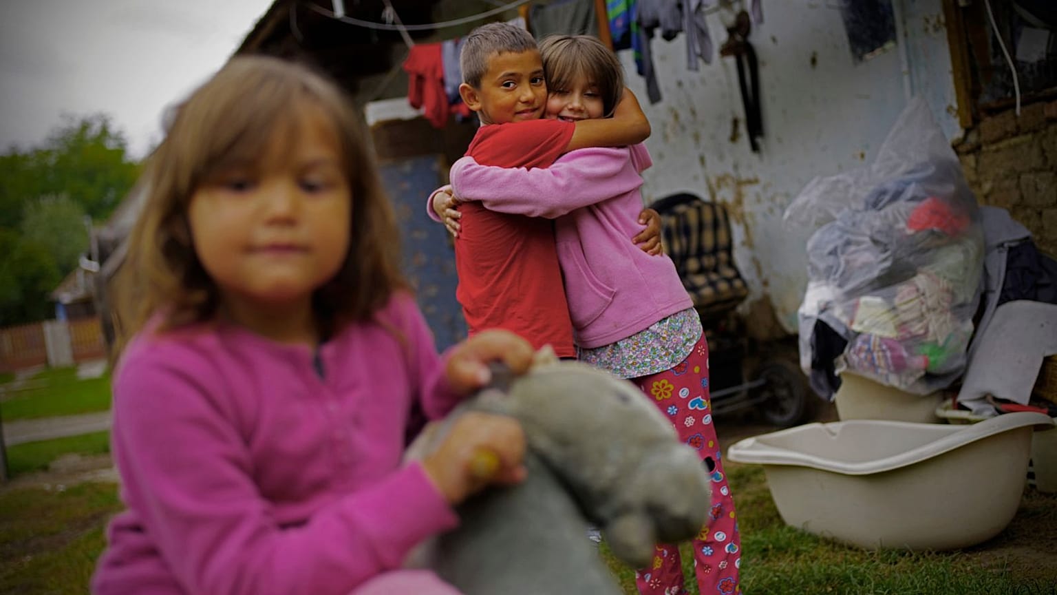 Roma children hug each other in the village of Kallo, Hungary, Sunday, Oct. 11, 2020. 