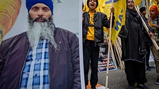 Protesters chant outside of the Consulate General of India office during a protest over the shooting of Hardeep Singh Nijjar in Vancouver, British Columbia, June 24, 2023