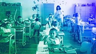 Ukrainian refugee children sit in a classroom at the Ienachita Vacarescu Elementary School after a ceremony for the beginning of the school year in Bucharest, September 2022