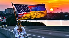 FILE - An American-Ukraine flag near the end of a march in the US marking the one-year anniversary of Russia invading Ukraine, late Thursday afternoon, Feb. 23, 2022.