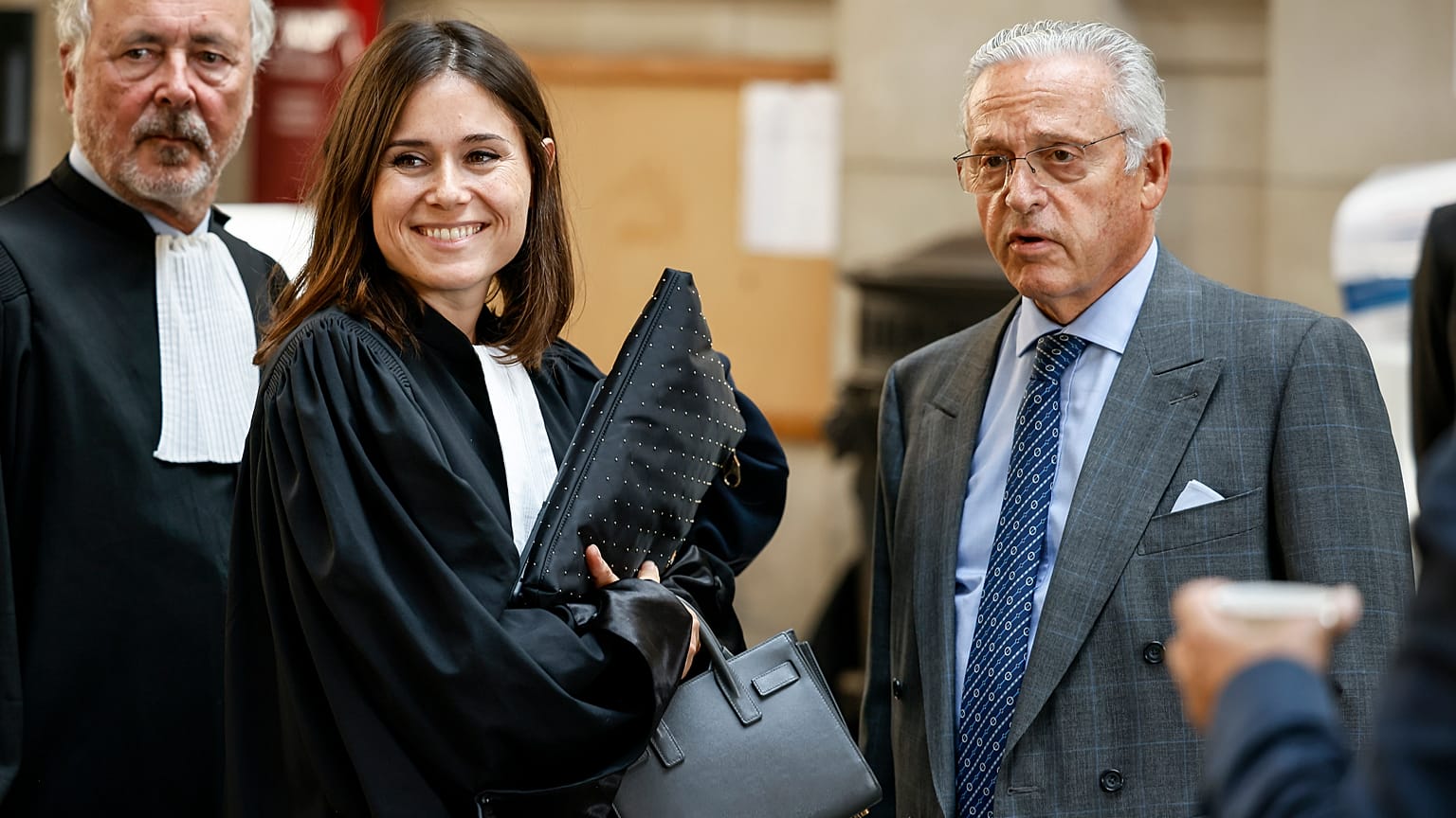 Guy Wildenstein (right) arrives at an appeals court in Paris for a new trial into tax fraud and money laundering.