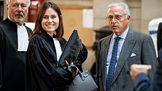 Guy Wildenstein (right) arrives at an appeals court in Paris for a new trial into tax fraud and money laundering.