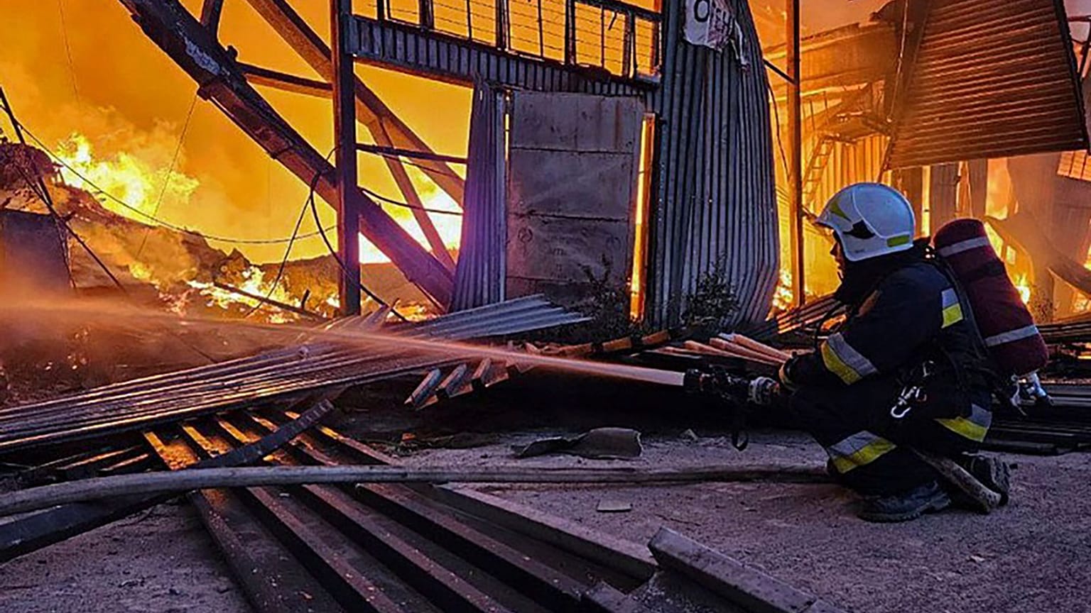 FILE - emergency services personnel work to extinguish a fire following a Russian attack in Lviv, Ukraine, Tuesday, Sept. 19, 2023. 