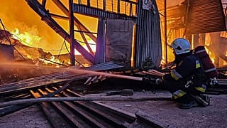 FILE - emergency services personnel work to extinguish a fire following a Russian attack in Lviv, Ukraine, Tuesday, Sept. 19, 2023. 