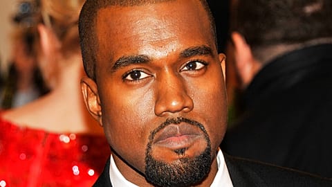 Ye, formerly known as Kanye West, watches an NBA basketball game between the Washington Wizards and the Los Angeles Lakers, March 11, 2022, in Los Angeles