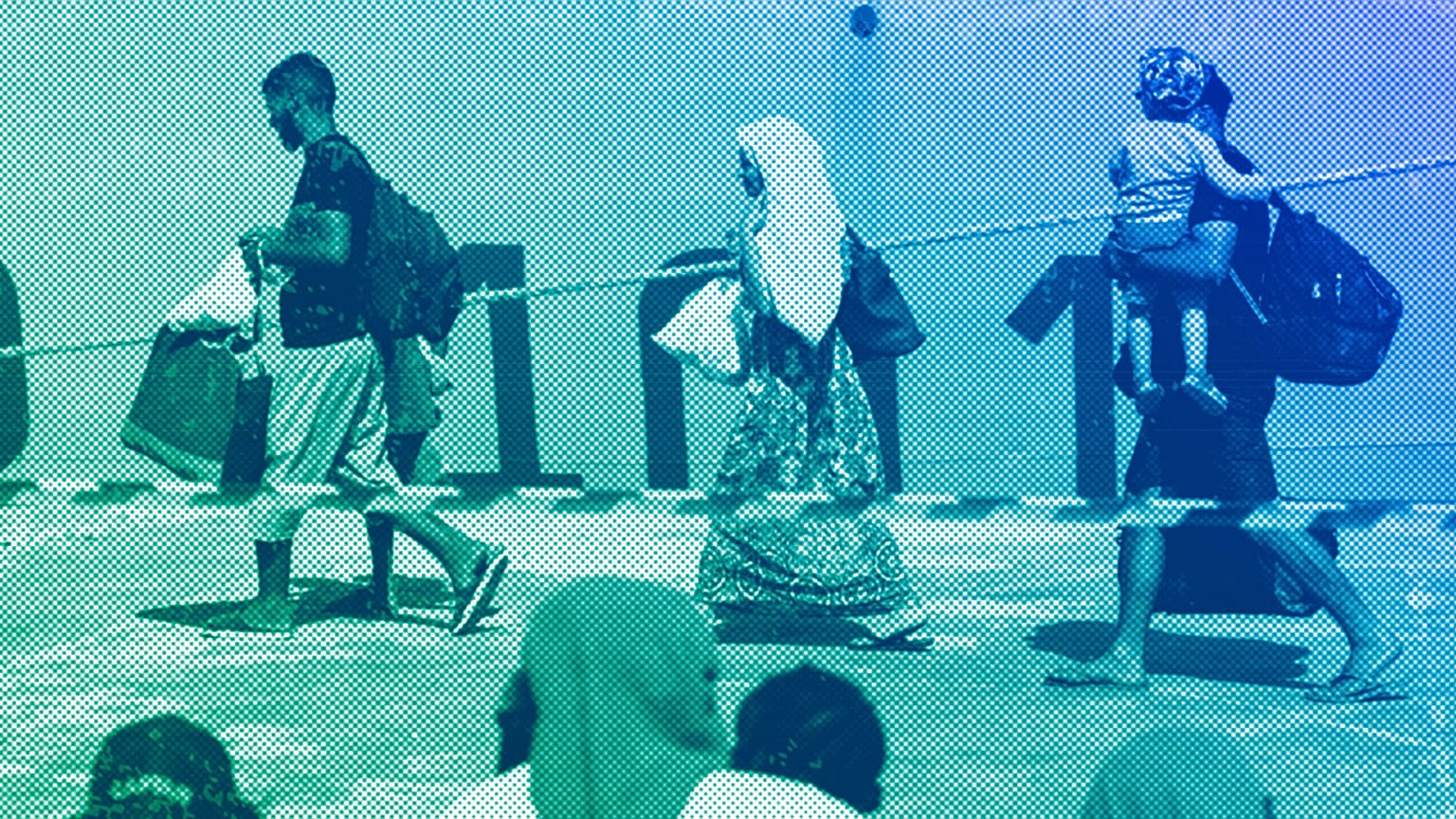Migrants wait to be transferred from the Lampedusa Island to the mainland, 15 September 2023