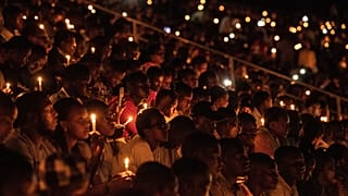 People hold candles during a commemoration ceremony of the 1994 Rwandan genocide in 2019