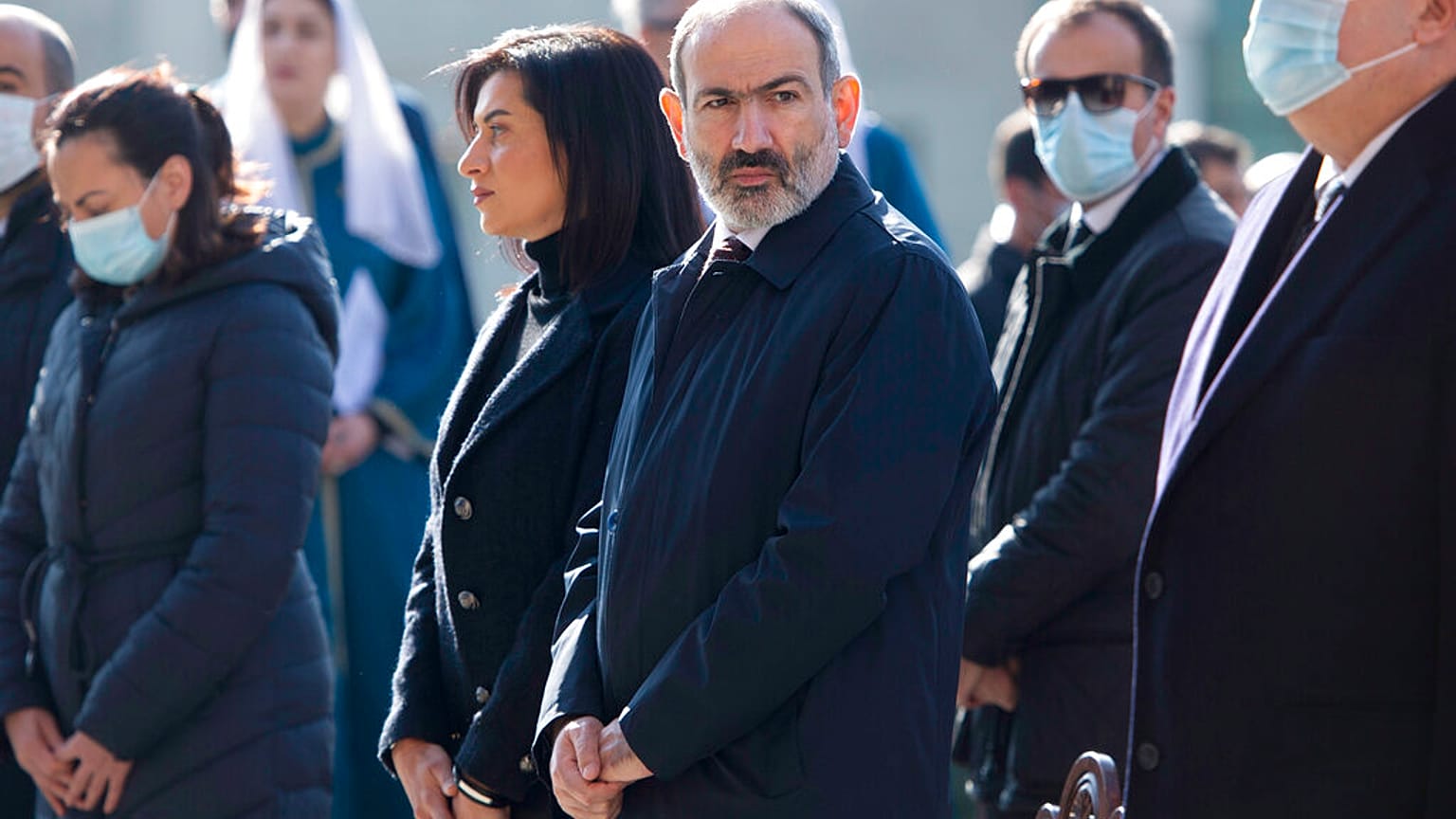 Armenia's Prime Minister Nikol Pashinian, centre, and his wife Anna Akobian, left of him, in 2020.