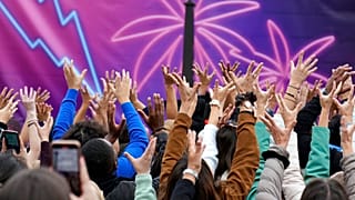 Partygoers dance on the Bastille Plaza during the 24th annual Techno parade in the streets of Paris, France, Saturday, Sept. 24, 2022