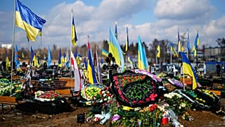 FILE - The grave of Yana Rikhlitska, 29, a Ukrainian army as a medic killed in the Bakhmut area, during the funeral in Vinnytsia, Ukraine, Tuesday, March 7, 2023.