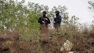 Kosovo police officers patrol an area near Banjska Monastery during a ongoing police operation in the village of Banjska on Monday, Sept. 25, 2023. 