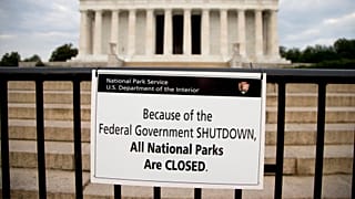 A sign reading "Because of the Federal Government SHUTDOWN All National Parks are Closed" is posted on a barricade in front of the Lincoln Memorial in Washington in 2013.