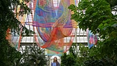 A garden employee poses for a picture for Kew Gardens' 'Queer Nature' autumn festival.