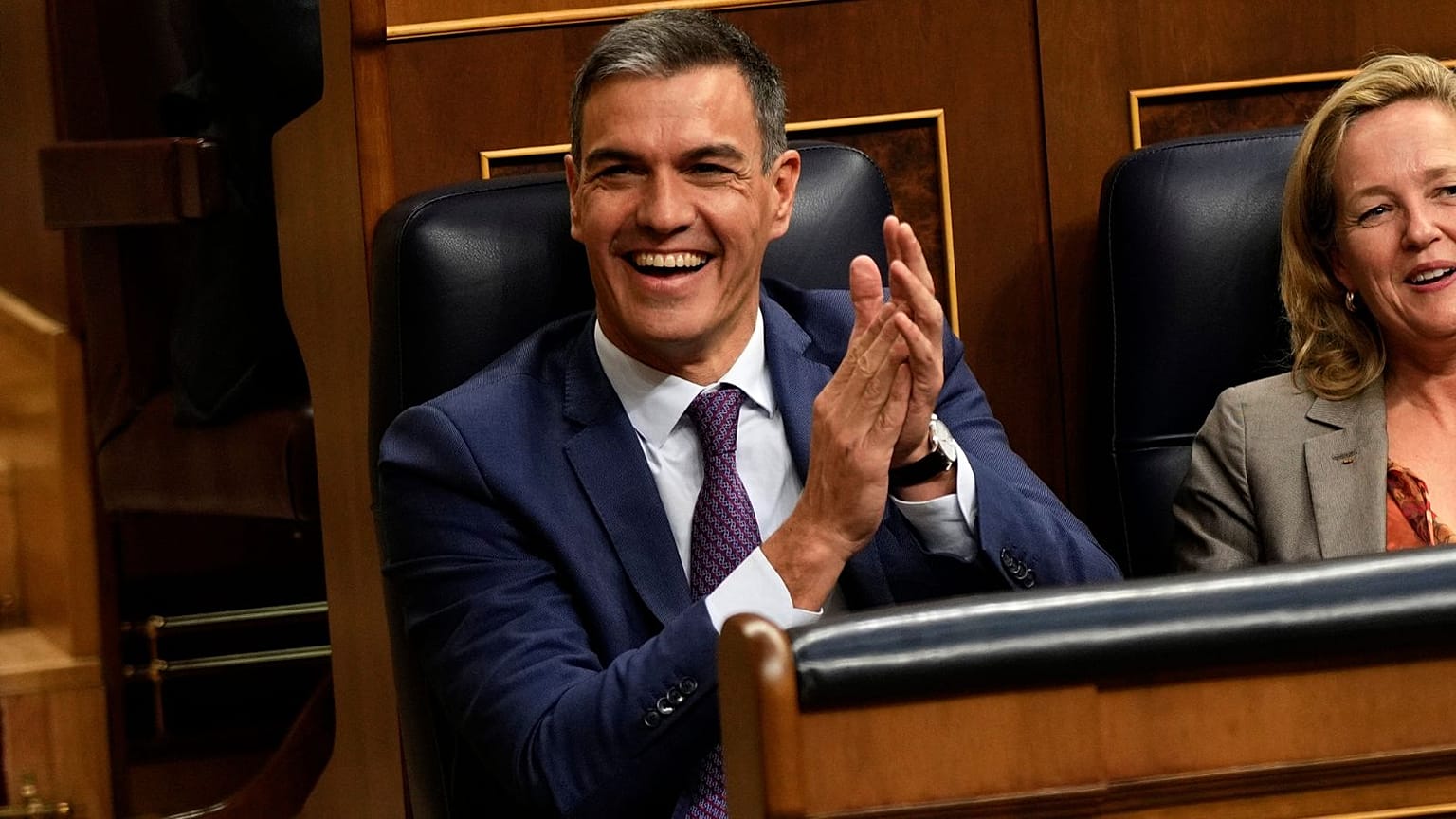 Acting Prime Minister Pedro Sanchez applauds at the Spanish parliament's lower house in Madrid