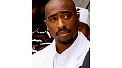 Rapper Tupac Shakur attends a voter registration event in South Central Los Angeles, Aug. 15, 1996. 