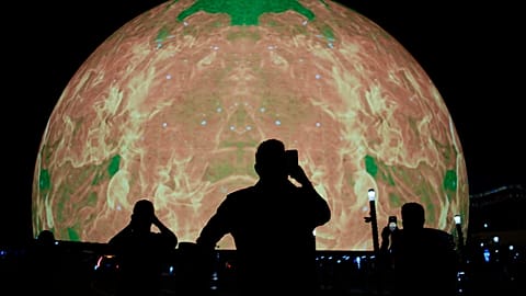 People take pictures during the opening night of the Sphere, Friday, Sept. 29, 2023, in Las Vegas.