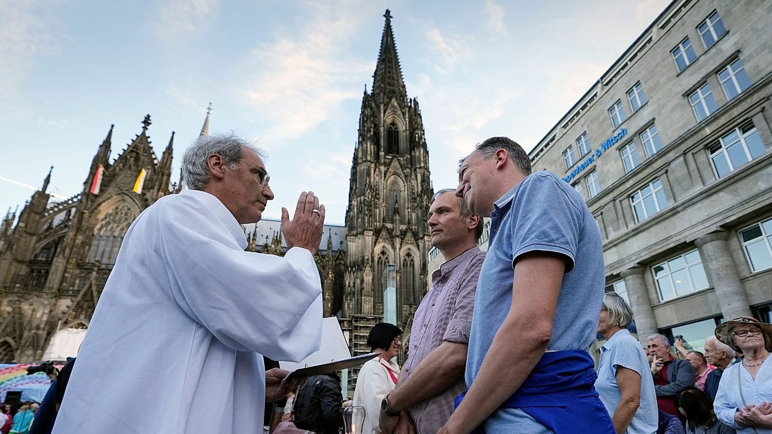 Same-sex couples take part in a public blessing ceremony in front of the Cologne Cathedral in Cologne, Germany, last month