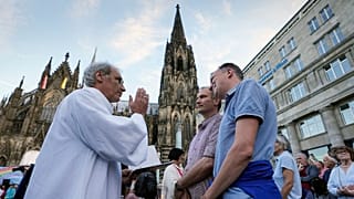 Same-sex couples take part in a public blessing ceremony in front of the Cologne Cathedral in Cologne, Germany, last month