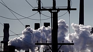Vapour pours from a steel mill chimney in the industrial town of Port Kembla, about 80 km (50 miles) south of Sydney July 7, 2011.