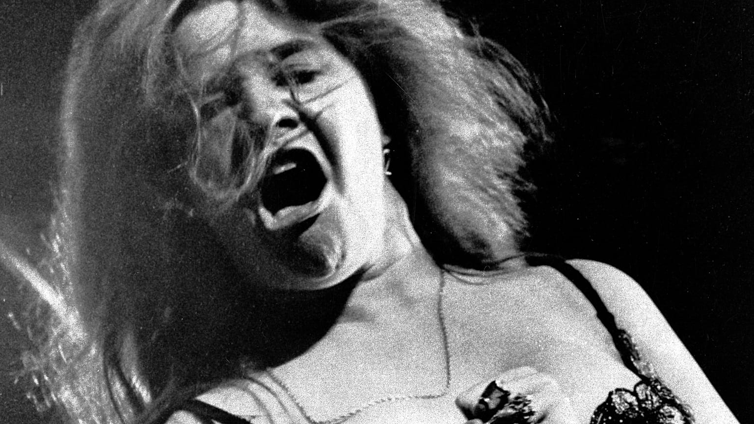 Blues/rock singer Janis Joplin performs at the Newport Folk Festival with her band Big Brother and the Holding Company, July 29, 1968.