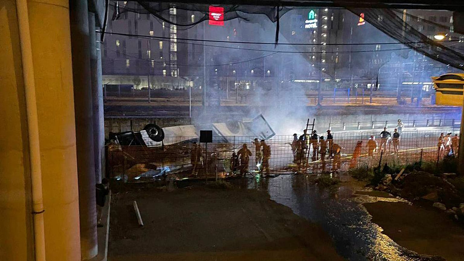 In this image made available by Italian State Police, Italian state police agents attend the scene of a passenger bus accident near the city of Venice, Italy.
