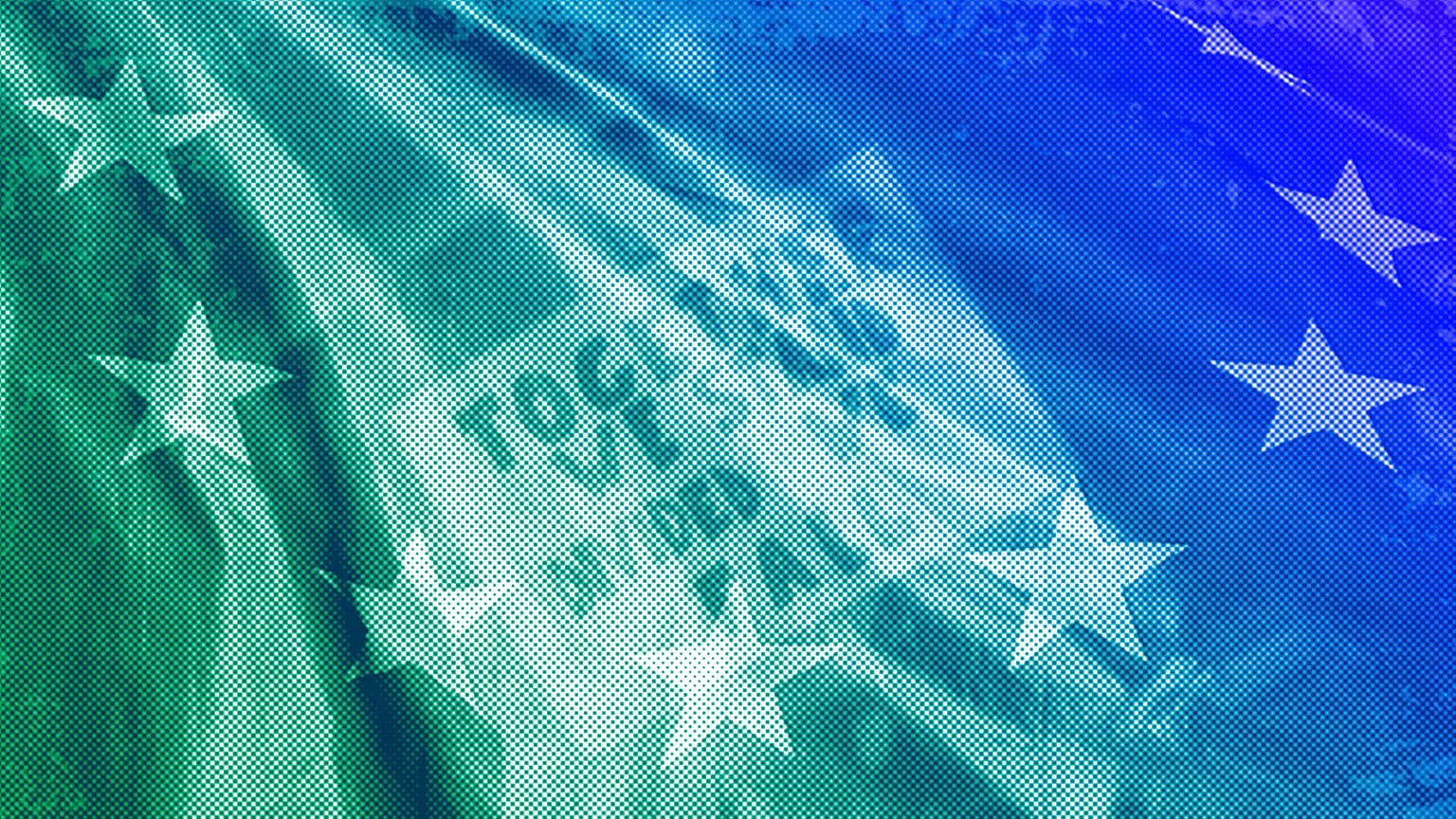  placard in support of the European Union is seen through a European flag at a pro-EU demonstration in Rome, March 2017