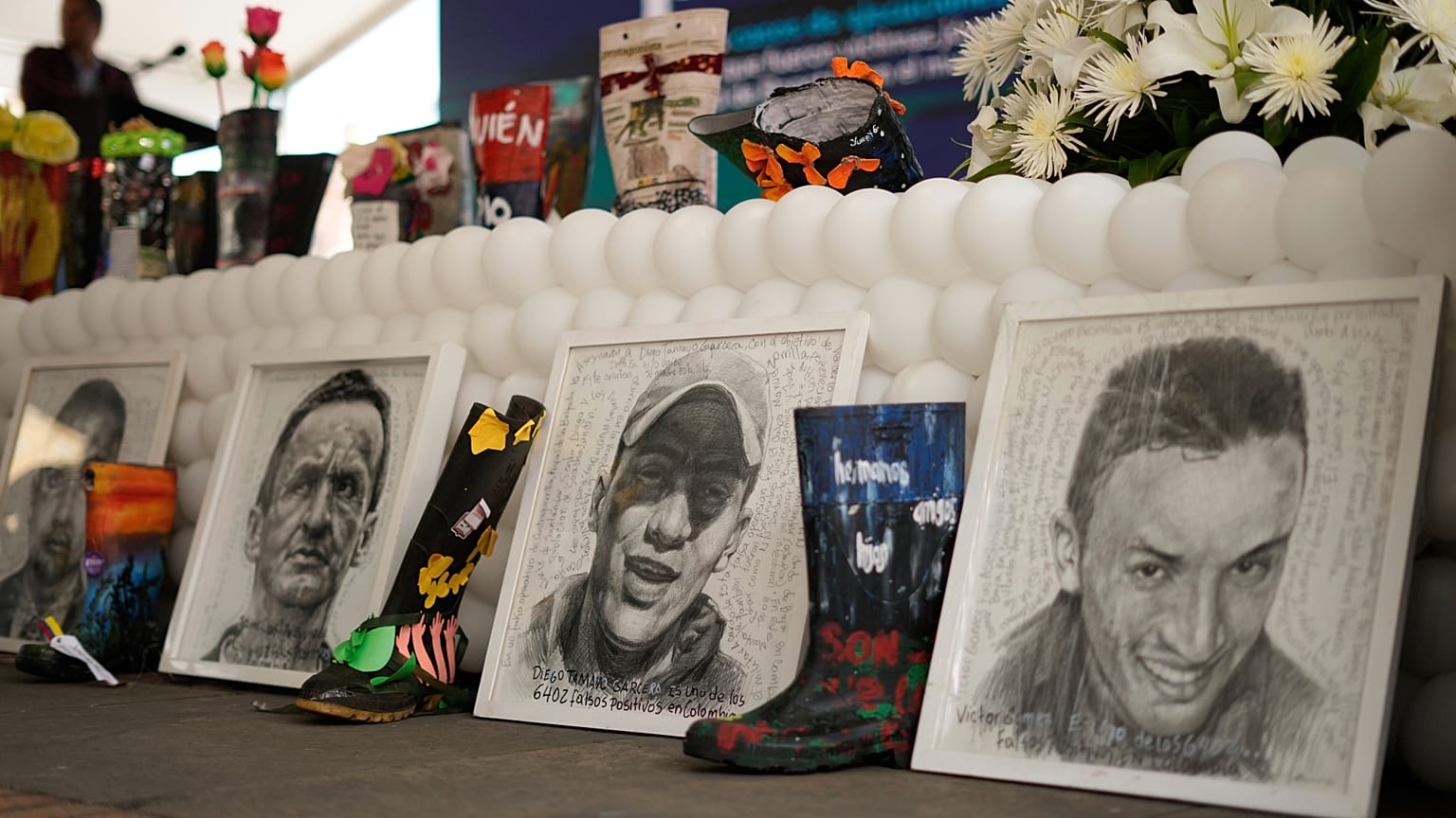 Images of the 19 young people who were falsely presented as guerrillas killed in combat by the Colombian army during the country's internal conflict.