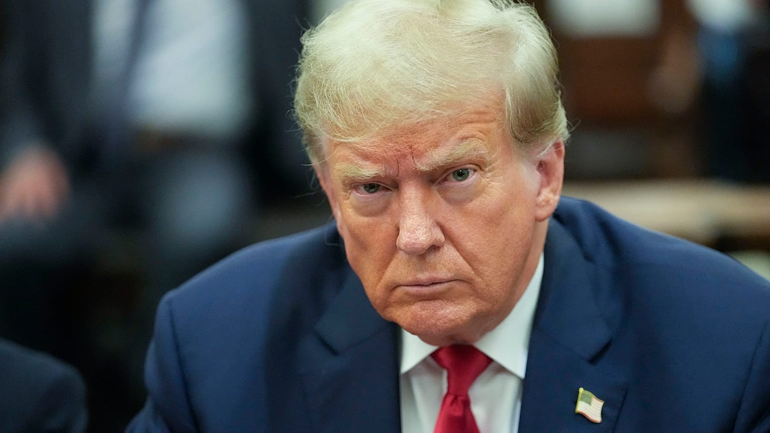 Former US President Donald Trump sits inside the courtroom for the third day of his civil fraud trial in New York on October 4, 2023. 