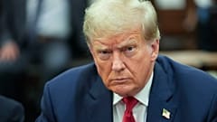 Former US President Donald Trump sits inside the courtroom for the third day of his civil fraud trial in New York on October 4, 2023. 