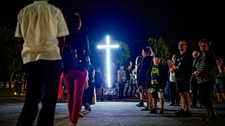 Locals attend a 'Via Crucis' (Way of the Cross) at the St. Gabriele dell'Addolorata sanctuary in Isola del Gran Sasso near Teramo in central Italy